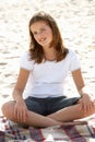 Portrait teenage girl cross legged sitting