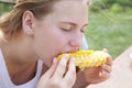 Portrait of a teenage girl eating sweet boiled corn