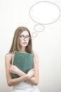 Portrait of teenage girl in glasses holding book on white copyspace background