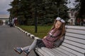 Portrait of a teenage girl with glasses, with a rucksack and white bows on the way to school in the mornin Royalty Free Stock Photo