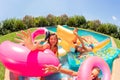 Cute girl having fun with friends in swimming pool Royalty Free Stock Photo