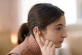 Portrait of teenage girl with hearing aid in her room. Royalty Free Stock Photo