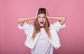 Funny girl holds on to her head and screams Royalty Free Stock Photo