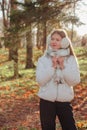 Portrait teenage girl looking away wearing casual fall clothes in an autumn natural park outdoors Royalty Free Stock Photo