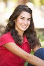 Portrait Of Teenage Girl Sitting In Park Royalty Free Stock Photo