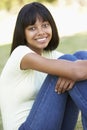 Portrait Of Teenage Girl Sitting In Park Royalty Free Stock Photo