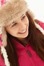 Portrait Of Teenage Girl In Snow Wearing Fur Hat Royalty Free Stock Photo