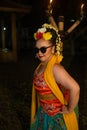 portrait of a teenage girl with sunglasses and a pretty flower posing very beautifully