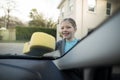 Teenage girl washing a car on a sunny day Royalty Free Stock Photo