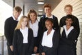 Portrait Of Teenage Students In Uniform Outside School Building Royalty Free Stock Photo