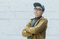 Portrait of teenage wearing cotton blue baseball cap and looking at camera Royalty Free Stock Photo