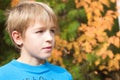 Portrait of a teenager in the autumn forest.