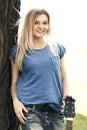 Portrait of a teenager with a guitar in the park