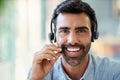 Portrait, telemarketing and man with customer service, smile and telecomsales, headphones and tech support. Person Royalty Free Stock Photo