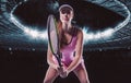 Portrait of a tennis player in a pink dress against the background of a sports arena. Olympic Games concept