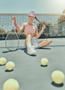 Portrait, tennis sports and woman on court with racket after workout, training or exercise. Fashion, fitness balls or