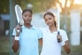 Portrait, tennis and teamwork with sports women standing on a court outdoor together ready for a game. Fitness