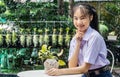 Portrait of thai junior high school student uniform beautiful girl wearing braces beauty smile sitting in the park Royalty Free Stock Photo