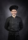 Portrait of a chef cooker in black uniform. Royalty Free Stock Photo