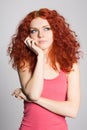 Portrait thinking red haired girl