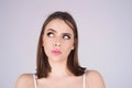 Portrait of thinking woman with confused puzzled face on studio isolated background. Woman thinking, pensive expression