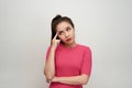 Portrait of thinking woman holding fingers on temples looking up having frustrated look trying to remember something important Royalty Free Stock Photo