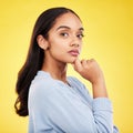 Portrait, thinking and a woman on a yellow background in studio feeling thoughtful or contemplative. Face, idea and an Royalty Free Stock Photo