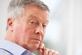 Portrait Of Thoughful Senior Man At Home Royalty Free Stock Photo