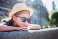 Portrait of a beautiful little girl wearing a hat and sunglasses Royalty Free Stock Photo