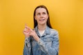 Portrait of thoughtful beautiful young woman bending fingers, counting and looking with contemplation, calculation, wearing denim Royalty Free Stock Photo