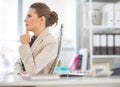 Portrait of thoughtful business woman in office Royalty Free Stock Photo