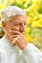 Portrait of a thoughtful elderly man solves Royalty Free Stock Photo