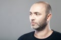 Portrait of thoughtful mature caucasian man isolated on gray Royalty Free Stock Photo