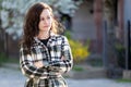 Portrait of thoughtful pretty young woman relaxing outdoors on warm spring sunny day Royalty Free Stock Photo