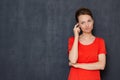 Portrait of thoughtful puzzled young woman thinking and being in doubt