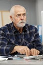 portrait thoughtful senior man with pc Royalty Free Stock Photo