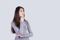 Portrait of thoughtful woman looking up and imagining isolated on white background. Positive student girl thinking of a solution Royalty Free Stock Photo