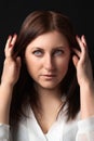 Portrait thoughtful woman worrying about personal problems, raised hands near head, looking away