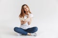 Portrait of a thoughtful young girl holding book Royalty Free Stock Photo