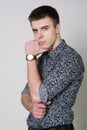 Portrait of a thoughtful young man wearing a shirt