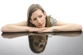 Thoughtful young woman leaning on a table Royalty Free Stock Photo