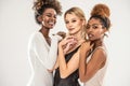 Portrait Of Three Attractive Young multiethnic Women In studio