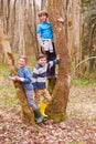 Portrait Of Three Boys Playing Game In Forest Royalty Free Stock Photo