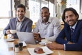 Portrait Of Three Businessmen Having Meeting In Coffee Shop Royalty Free Stock Photo