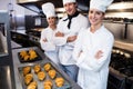 Portrait of three chefs in commercial kitchen Royalty Free Stock Photo