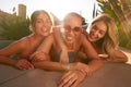 Portrait Of Three Female Friends Outdoors Relaxing In Swimming Pool And Enjoying Summer Pool Party Royalty Free Stock Photo