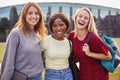 Portrait Of Three Female University Or College Student Standing Outdoors By Modern Campus Building Royalty Free Stock Photo
