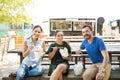 Three friends eating takeout food Royalty Free Stock Photo