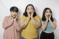 A portrait of three friends shocked, expressing disbelief feeling, isolated by a white background