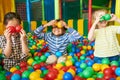 Happy Kids Playing in Ball Pit Royalty Free Stock Photo